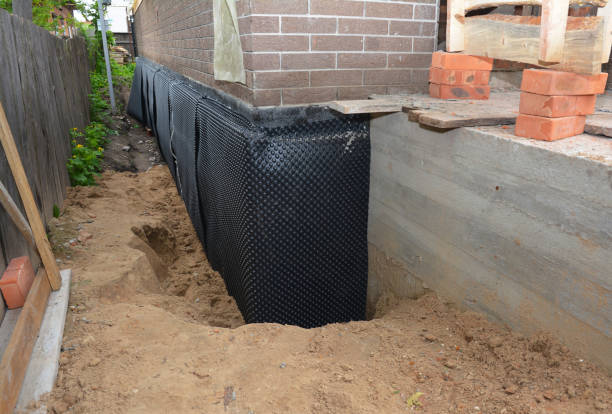 Happy homeowners after waterproofing job in Fowlerville